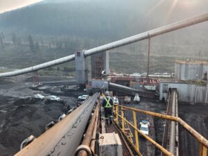 Aggregate plant Supervisor walking along a machine