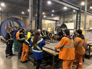 Apprenticeship Class Group of workers discussing plans at the apprenticeship program