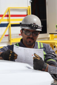 Worker Worker reviewing procedures