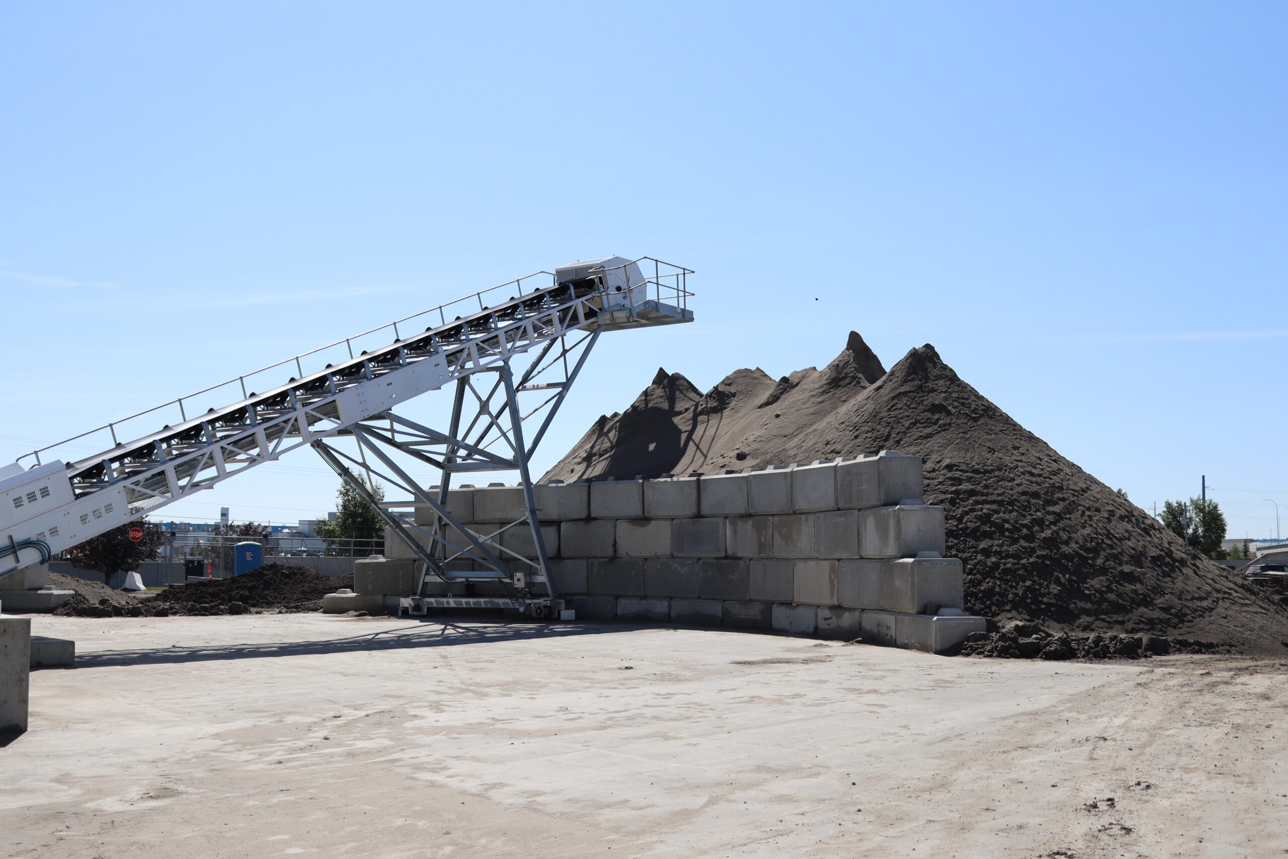 Industries Conveyor trough idlers under a overhang